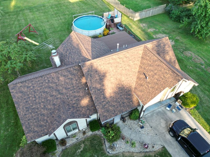 Brown asphalt shingle roof replacement on a two-story home in Fort Wayne, Indiana